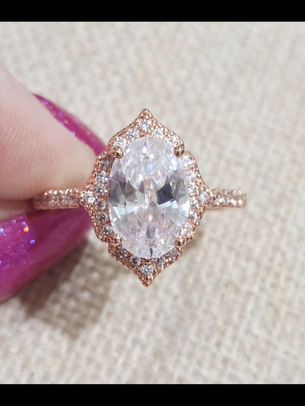 Rose Gold Oval Halo Engagement Ring with Clear Center Stone